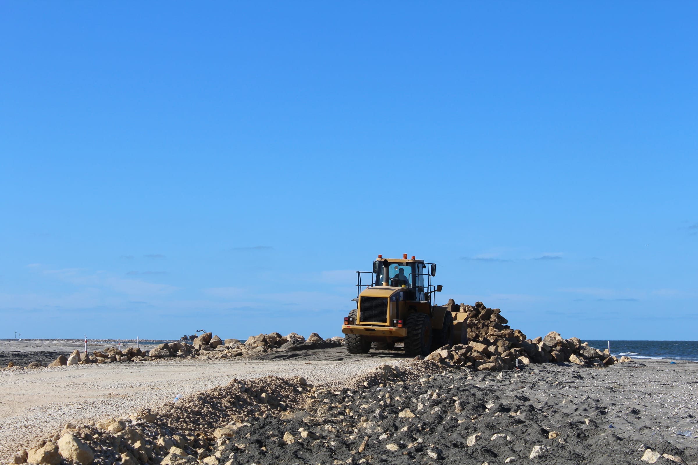 Temporary marine causeway under construction from the shoreline.